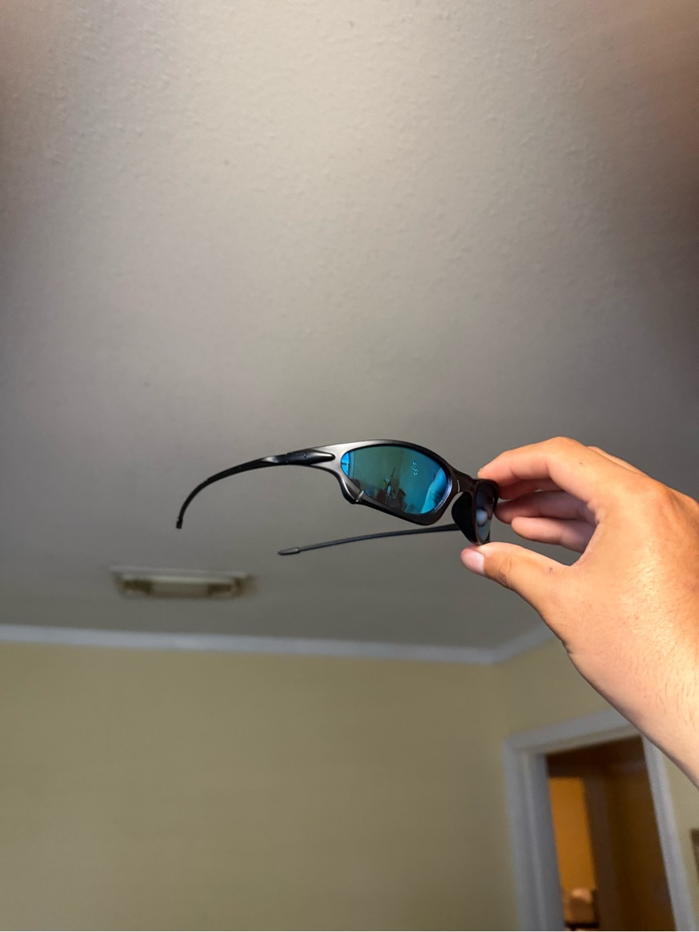Black Oakley Accessory Sunglasses with Blue Mirrored Lenses